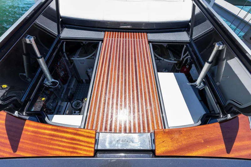 Slide: The Image of 2022 Riva 38 Rivamare engine compartment with polished wooden deck. - 24