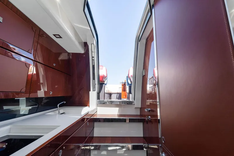 Slide: The Image of Interior view of 2022 Riva 38 Rivamare yacht with sleek wooden finishes. - 25