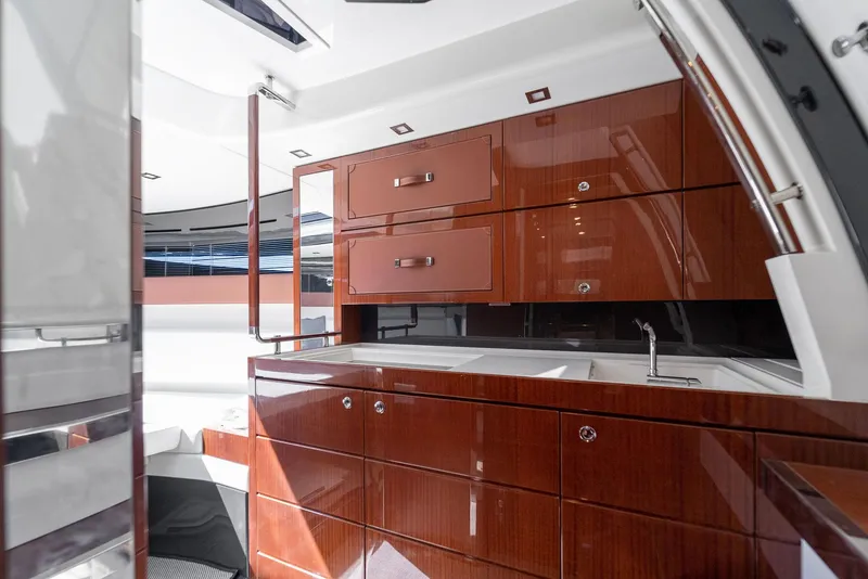 Slide: The Image of Luxurious interior of 2022 Riva 38 Rivamare yacht with polished wood cabinetry. - 26
