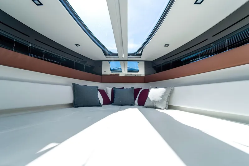 Slide: The Image of Interior cabin of 2022 Riva 38 Rivamare yacht with skylight and cushions. - 32