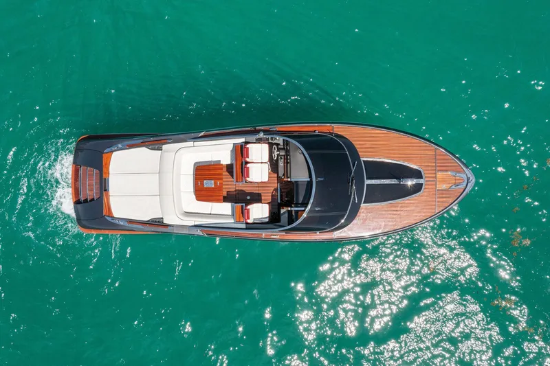 Slide: The Image of Aerial view of 2022 Riva 38 Rivamare yacht on turquoise water. - 8
