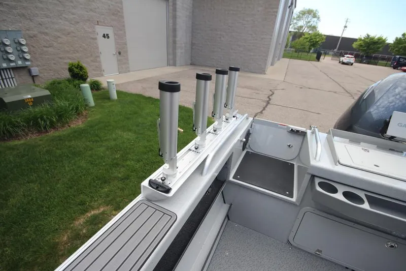 Slide: The Image of 2023 Weldcraft 210 Revolution F200XB Walleye Edition boat with rod holders. - 19