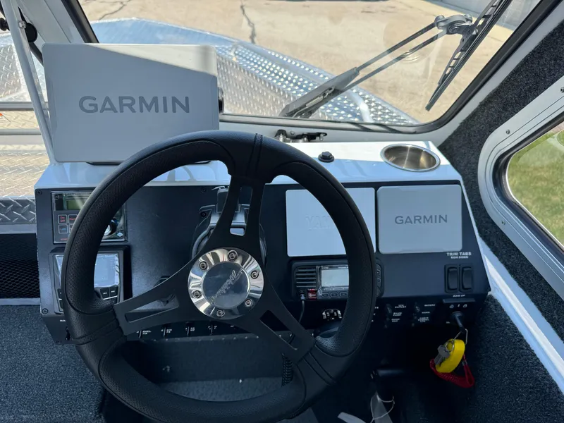 Slide: The Image of 2023 Weldcraft 210 Revolution F200XB Walleye Edition boat dashboard with Garmin navigation system. - 24