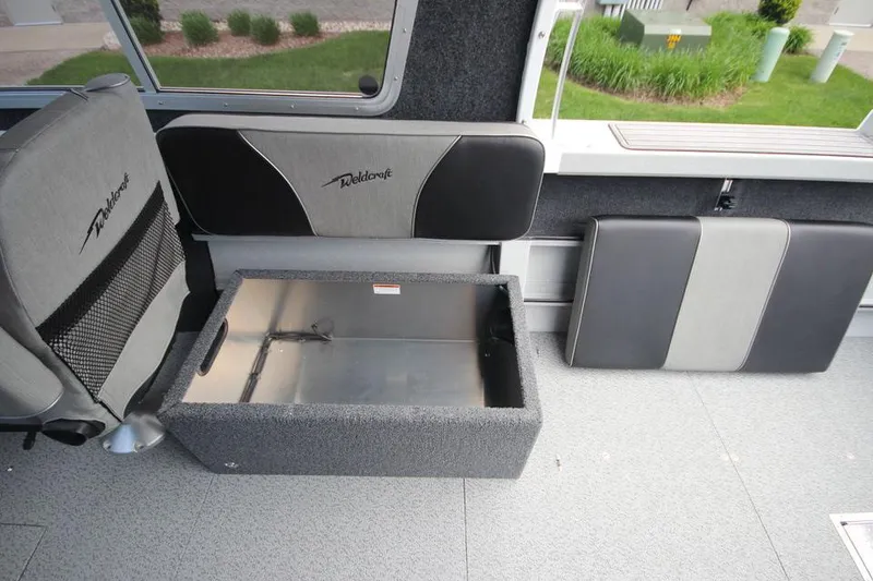 Slide: The Image of 2023 Weldcraft 210 Revolution F200XB Walleye Edition interior seating and storage. - 31