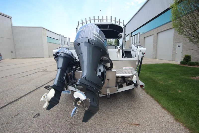 Slide: The Image of 2023 Weldcraft 210 Revolution F200XB Walleye Edition boat with dual outboard motors. - 6