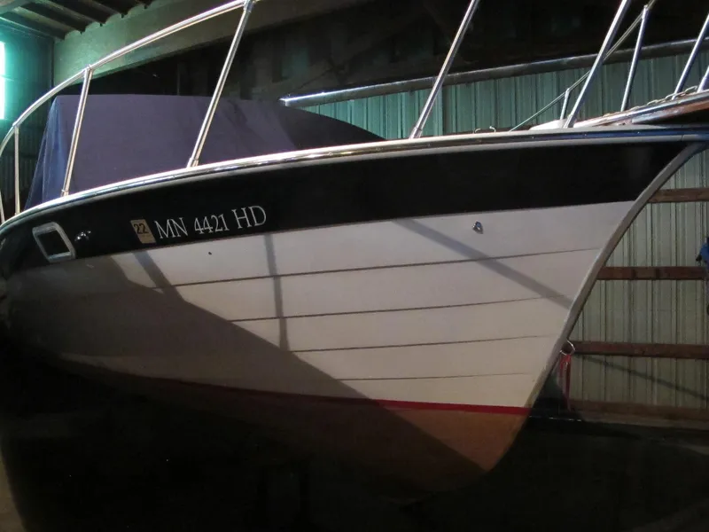 Slide: The Image of 1990 Skiff Craft 26 boat in storage, side view. - 4