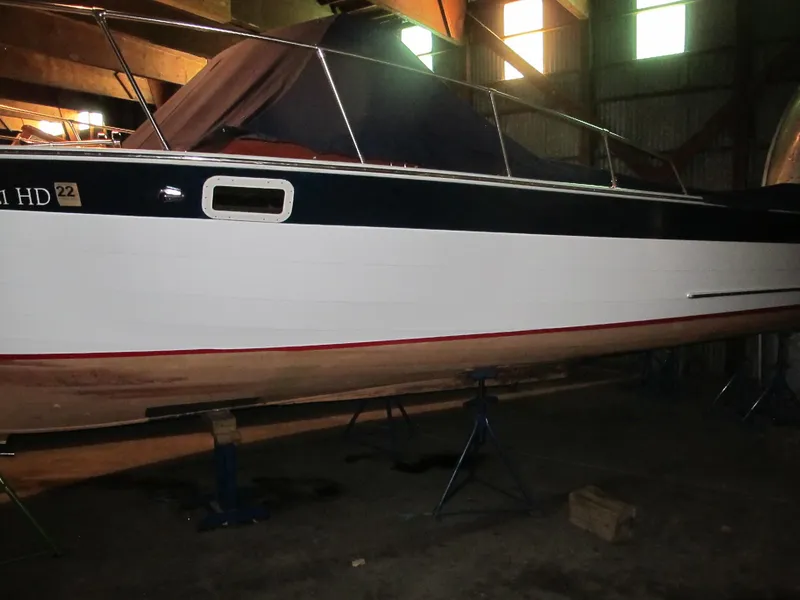 Slide: The Image of 1990 Skiff Craft 26 boat in storage on stands. - 5