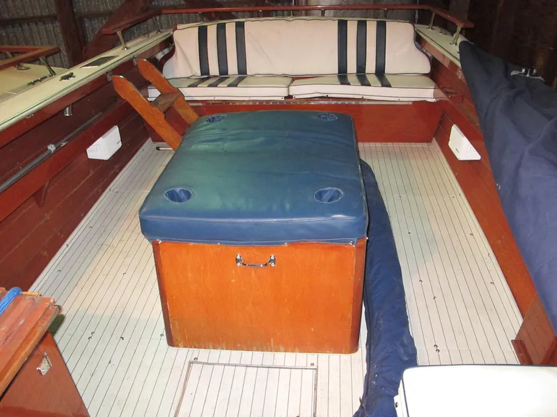 Slide: The Image of 1990 Skiff Craft 26 interior with seating and storage. - 8