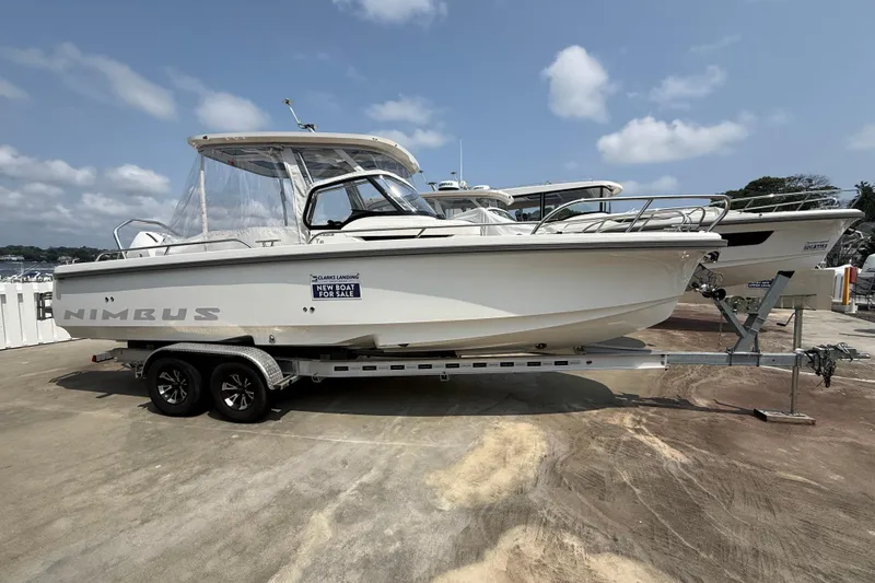 The Image of 2025 Nimbus Tender 8 boat on trailer, for sale under clear skies. - 0