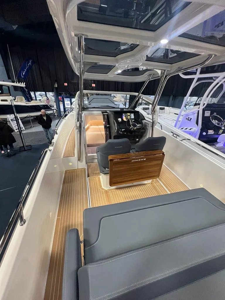 Slide: The Image of 2025 Nimbus Tender 8 boat interior with sleek design and modern seating. - 5