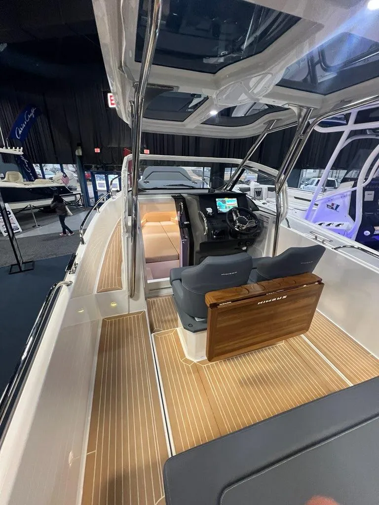 Slide: The Image of 2025 Nimbus Tender 8 boat interior with sleek design and modern dashboard. - 7