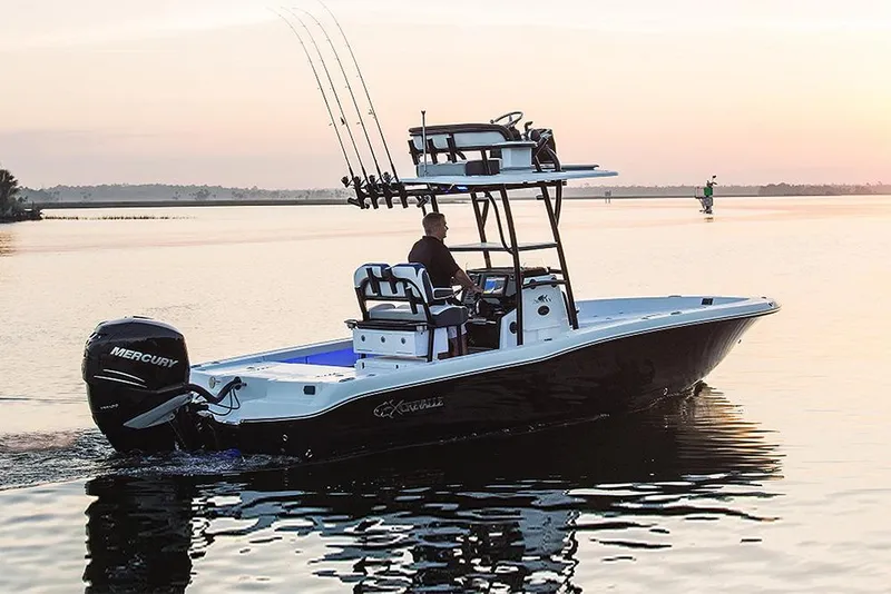 Slide: The Image of 2023 Crevalle 26 HBW boat on calm water at sunset. - 10