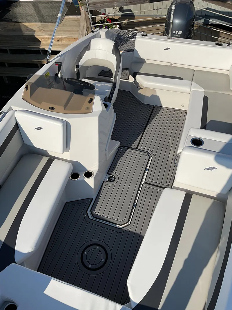 Slide: The Image of 2023 Starcraft 171 SVX boat interior with seating and steering console. - 5