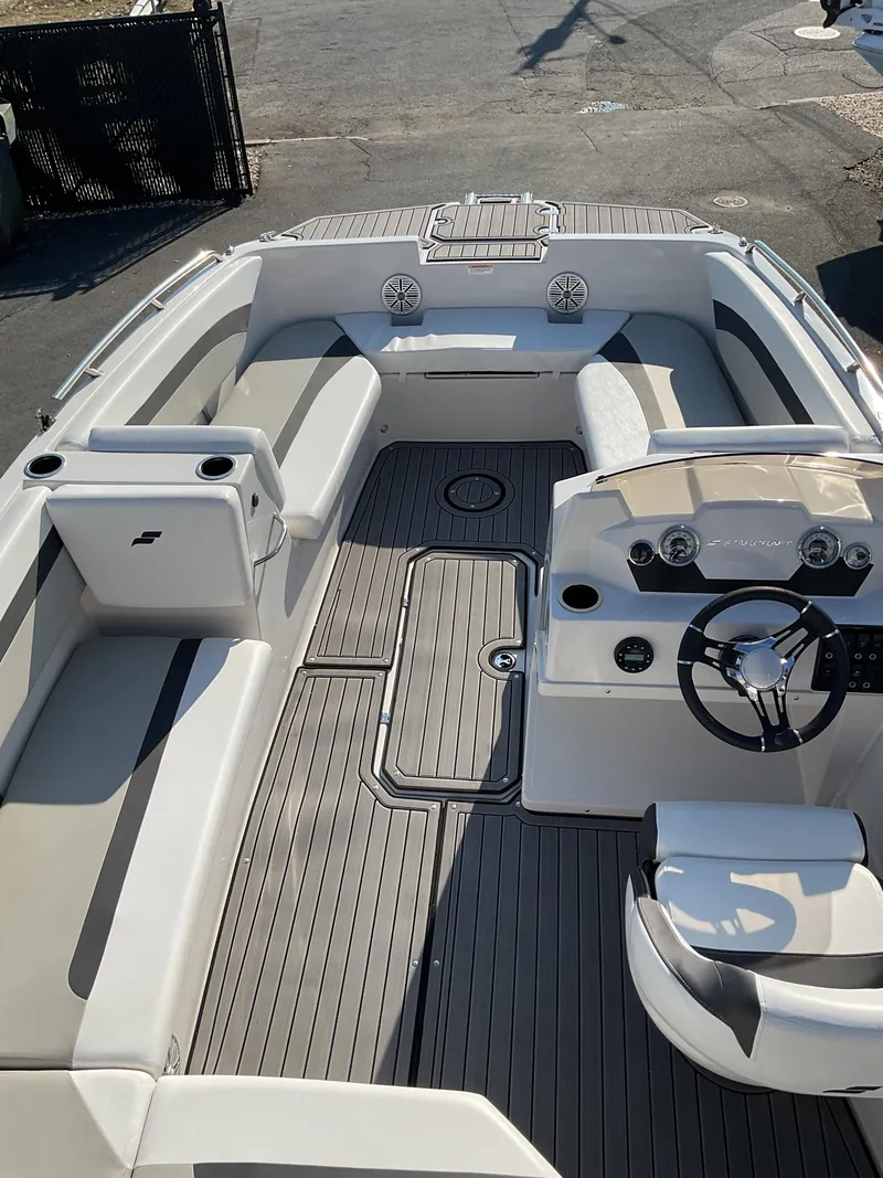Slide: The Image of 2023 Starcraft 171 SVX boat interior with seating and steering wheel, featuring modern design. - 6