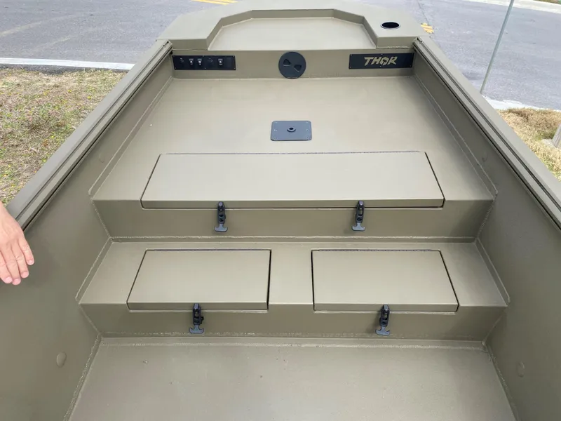 Slide: The Image of 2023 Thor Lake Hammer boat interior with storage compartments. - 12