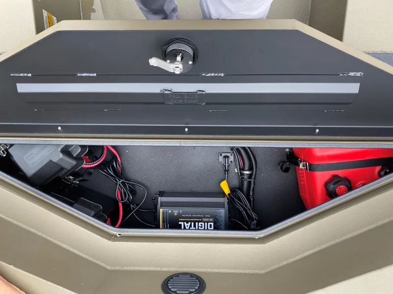 Slide: The Image of Thor Lake Hammer 2023 boat storage compartment with battery and wiring. - 14