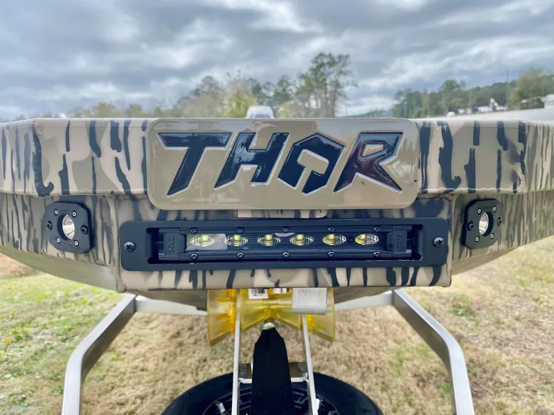 Slide: The Image of 2023 Thor Lake Hammer boat rear view with logo and LED lights. - 9
