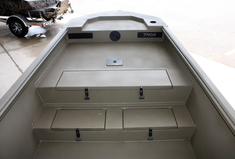 Slide: The Image of 2023 Thor Lake Hammer boat interior with storage compartments. - 2