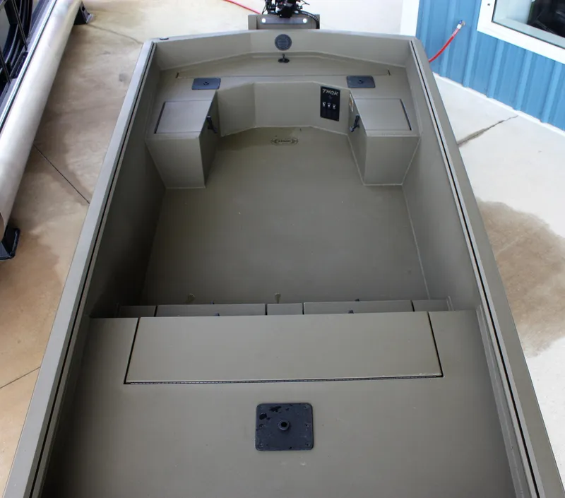 Slide: The Image of 2023 Thor Lake Hammer boat interior with storage compartments and seating. - 3