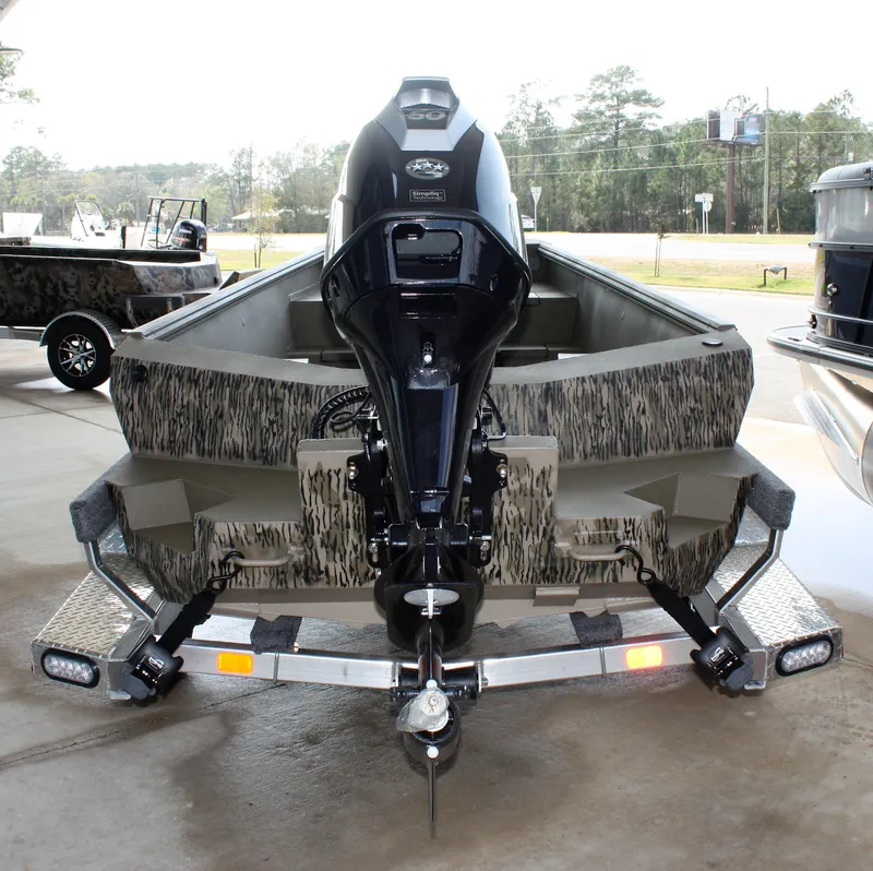 Slide: The Image of 2023 Thor Lake Hammer boat on trailer, rear view with outboard motor. - 9