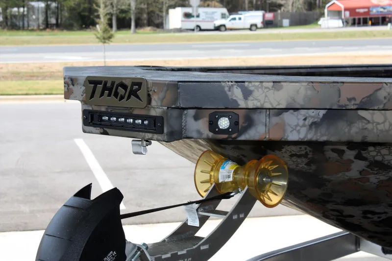 Slide: The Image of 2023 Thor Lake Hammer boat on trailer, close-up of front section. - 13