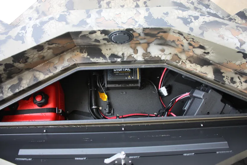 Slide: The Image of 2023 Thor Lake Hammer boat storage compartment with battery and wiring. - 6