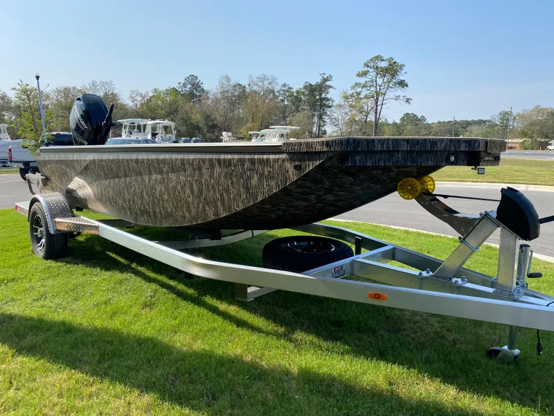 Slide: The Image of 2023 Thor Lake Hammer boat on a trailer, parked on grass. - 3