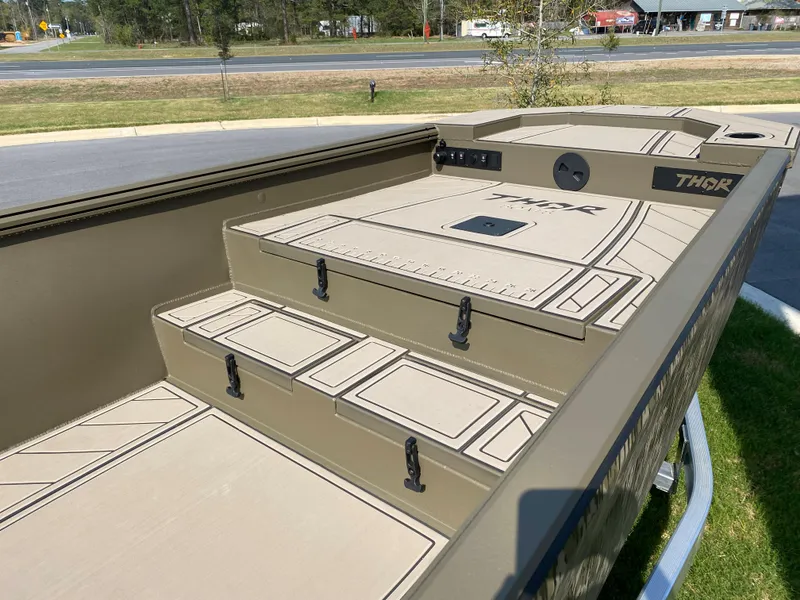 Slide: The Image of 2023 Thor Lake Hammer boat interior with storage compartments and seating. - 6