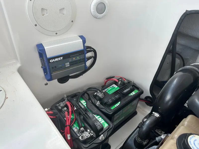 Slide: The Image of Battery compartment of 2007 Glasstream 273 XS with charger and wiring. - 10