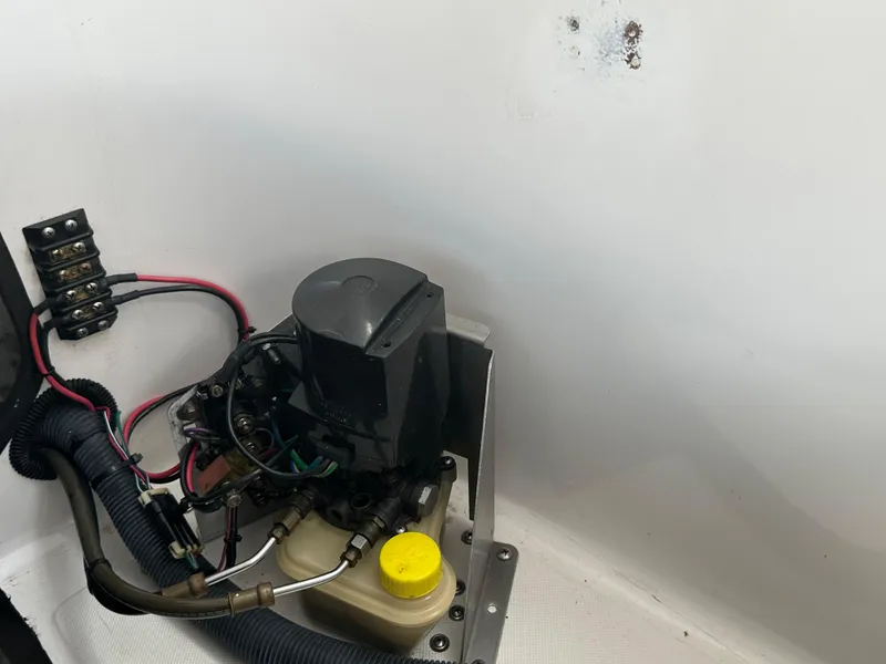 Slide: The Image of Engine compartment of a 2007 Glasstream 273 XS boat, showing wiring and components. - 11