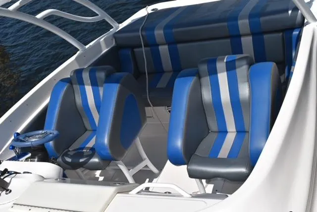 Slide: The Image of 2007 Glasstream 273 XS boat interior with blue and gray seating. - 16