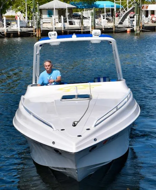 Slide: The Image of 2007 Glasstream 273 XS boat cruising on a sunny day in a marina. - 2