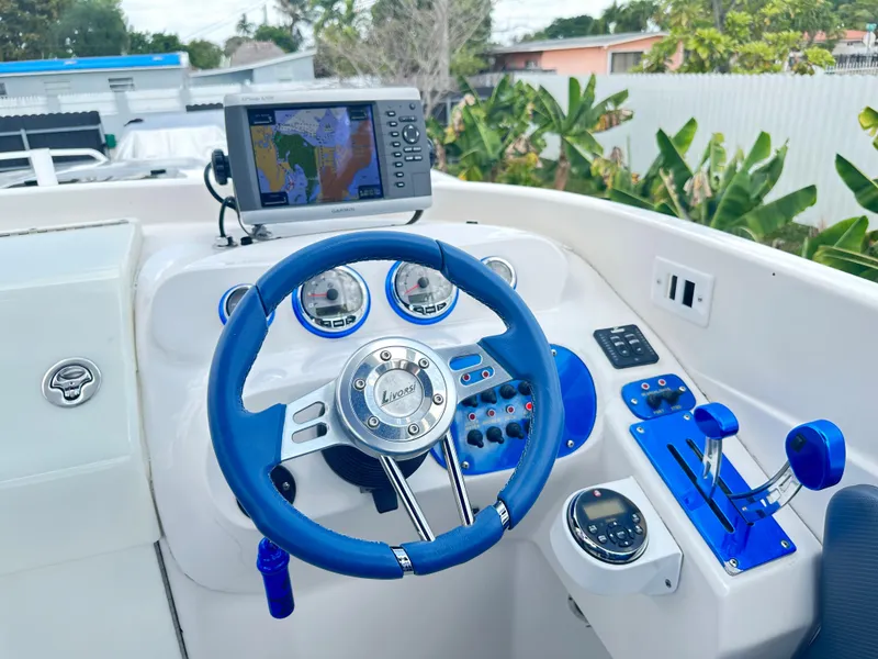 Slide: The Image of 2007 Glasstream 273 XS boat dashboard with blue accents and navigation system. - 21