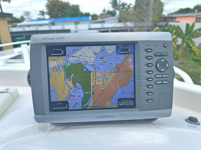 Slide: The Image of Garmin GPSmap 440s on 2007 Glasstream 273 XS boat, displaying nautical chart. - 22