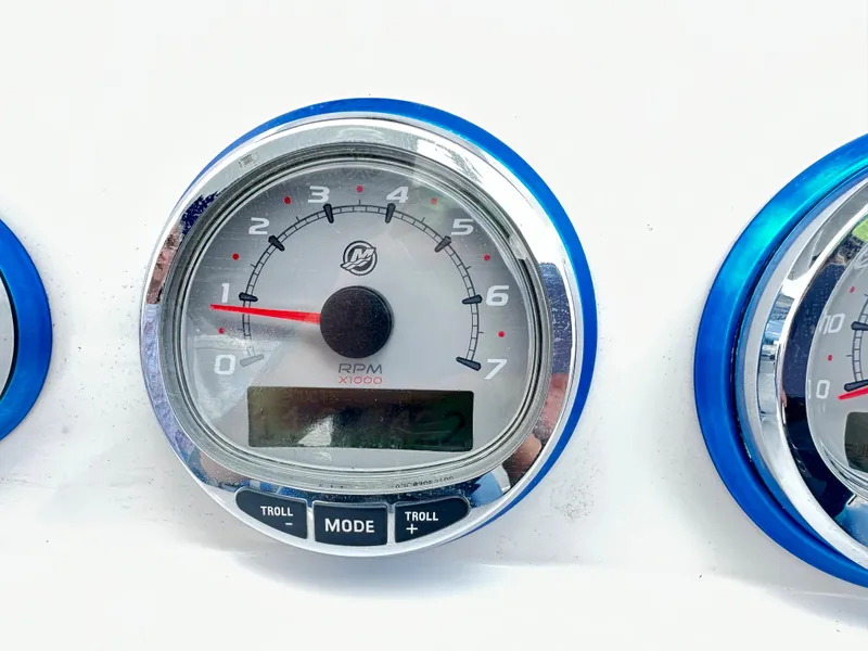 Slide: The Image of Tachometer gauge on 2007 Glasstream 273 XS boat dashboard, displaying RPM with digital display. - 23