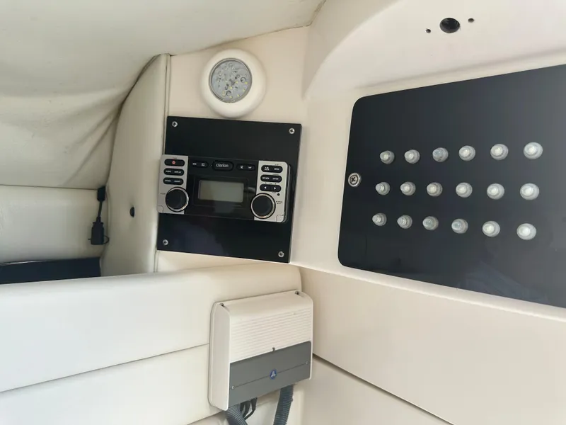 Slide: The Image of Interior dashboard of 2007 Glasstream 273 XS boat with control panel and radio system. - 26