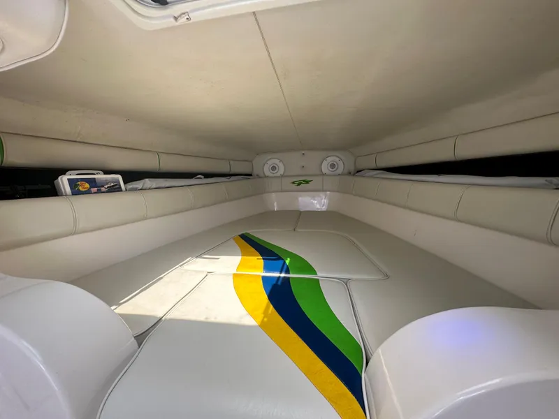 Slide: The Image of Interior of 2007 Glasstream 273 XS boat with colorful seating and storage compartments. - 30