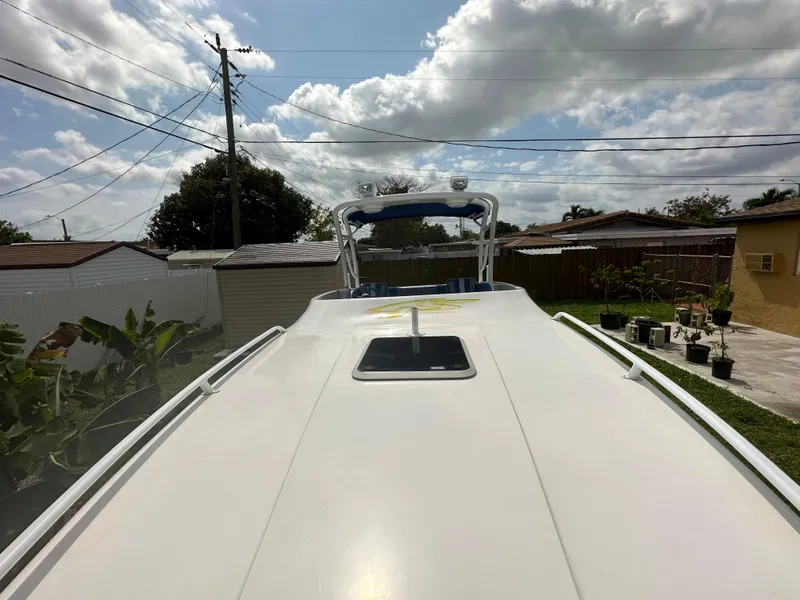 Slide: The Image of 2007 Glasstream 273 XS boat, view from bow, under a partly cloudy sky. - 36