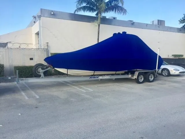 Slide: The Image of 2007 Glasstream 273 XS boat covered on trailer in parking lot. - 39