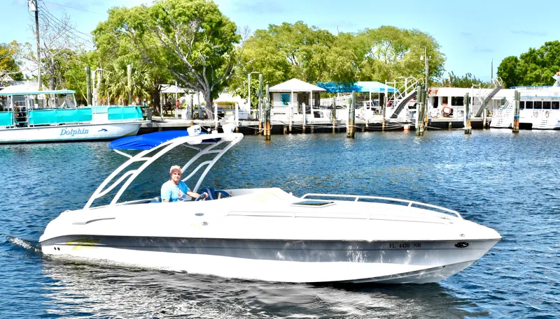 Slide: The Image of 2007 Glasstream 273 XS boat cruising on a sunny day near a marina. - 41