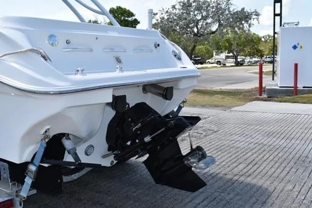 Slide: The Image of 2007 Glasstream 273 XS boat stern view with outboard motor on a concrete ramp. - 5