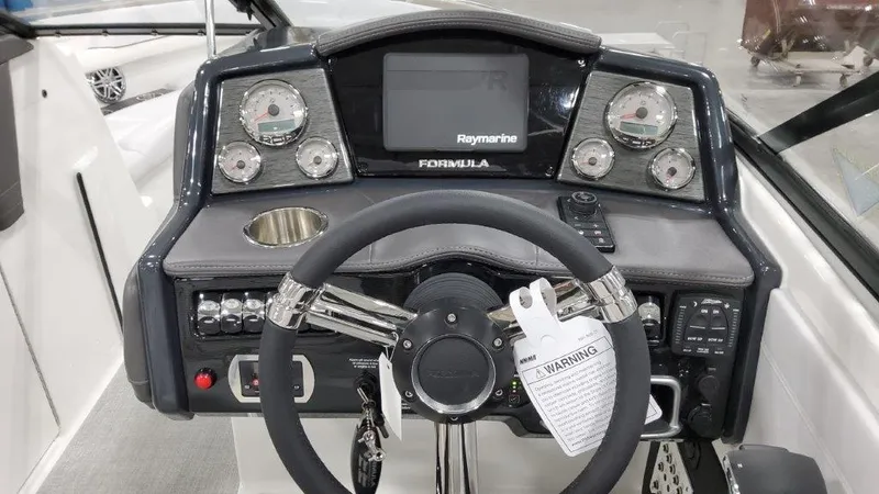 Slide: The Image of 2023 Formula 240 Bowrider boat interior with compact marine toilet. - 10
