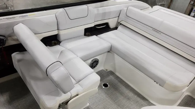Slide: The Image of 2023 Formula 240 Bowrider in a factory setting, showcasing sleek design and craftsmanship. - 15