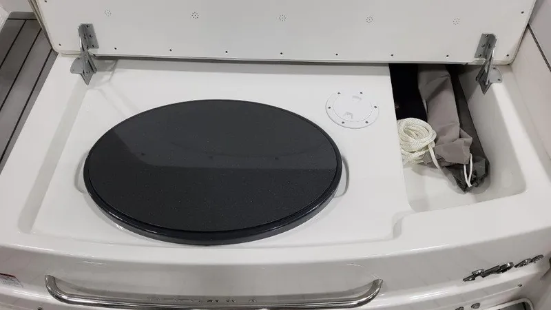 Slide: The Image of 2023 Formula 240 Bowrider boat in a warehouse setting, showcasing sleek design and modern features. - 18