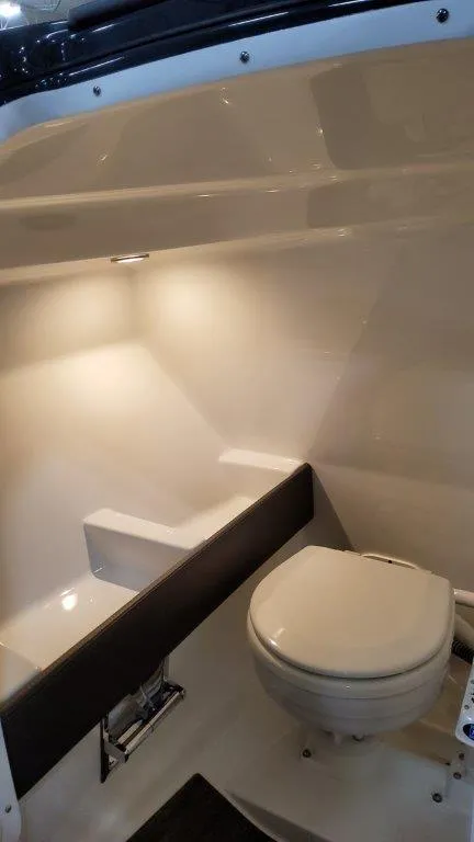 Slide: The Image of 2023 Formula 240 Bowrider interior with compact marine toilet. - 29
