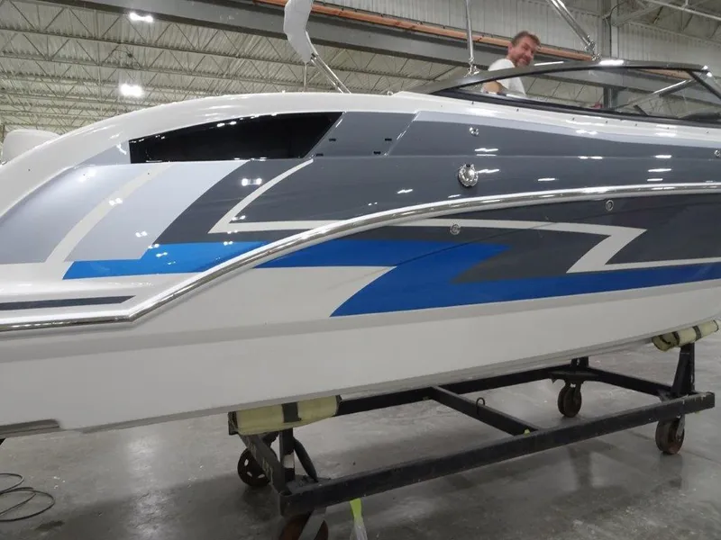 Slide: The Image of 2023 Formula 240 Bowrider interior with white seating and sleek design. - 5