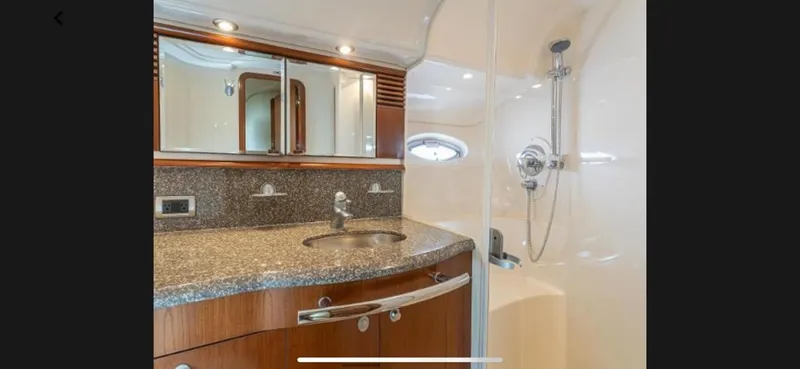 Slide: The Image of 2005 Sea Ray 500 Sundancer yacht bathroom with granite countertop and shower - 10