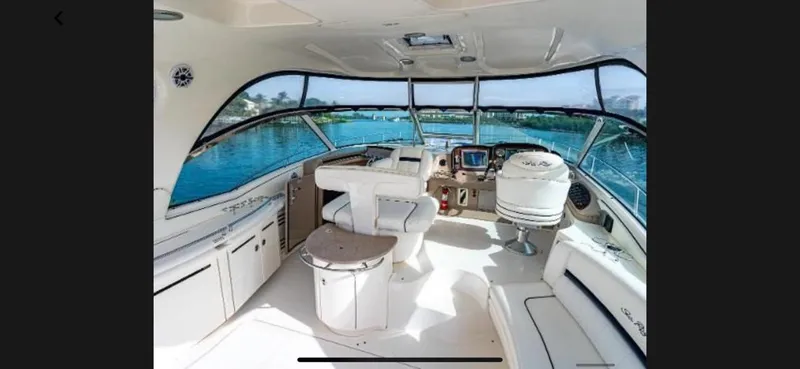Slide: The Image of Interior of 2005 Sea Ray 500 Sundancer yacht with panoramic windows and luxurious seating. - 14