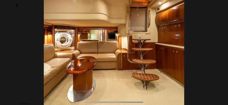 Slide: The Image of Luxurious interior of a 2005 Sea Ray 500 Sundancer yacht with elegant wood finishes. - 3