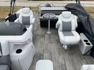 Slide: The Image of 2024 Sweetwater 2286SFL pontoon boat interior with plush seating and modern design. - 18